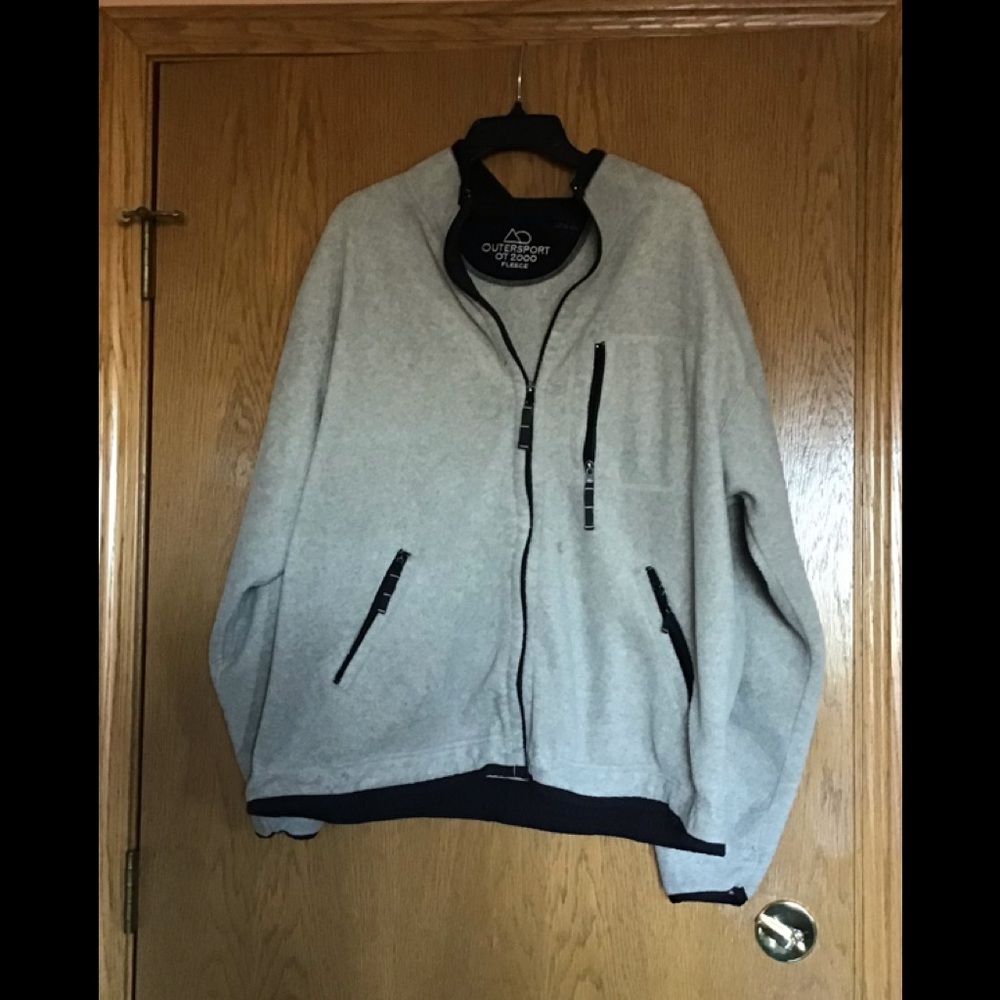 Fleece winter sweater, zippered in front, with 3 zippered pockets in front.